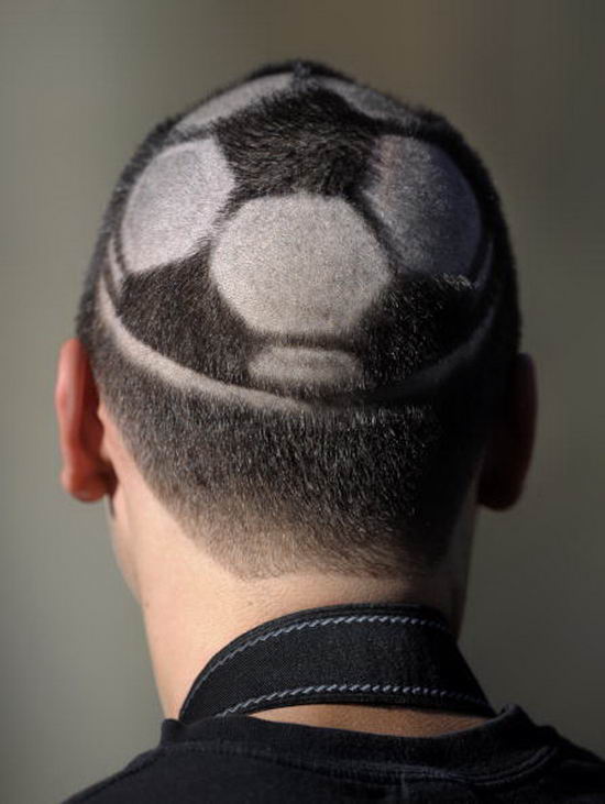 A football fan shows his haircut before